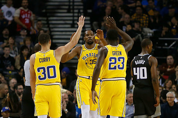 Kevin Durant #35 of the Golden State Warriors celebrates with teammates