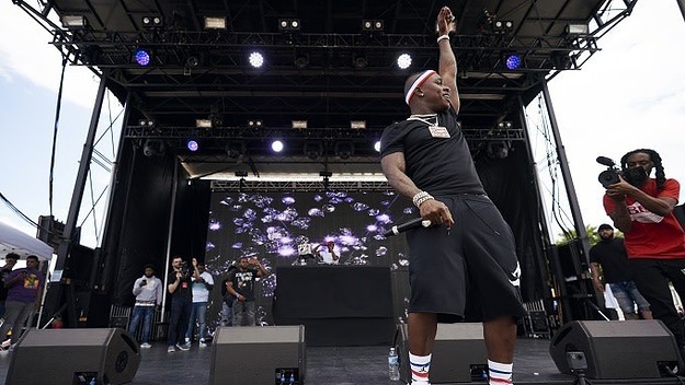 DaBaby Performs At AAC In Louis Vuitton Hat, Balenciaga Sweater