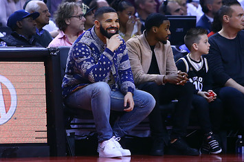 Drake sits courtside during 76ers/Raptors 2019 NBA Playoffs game. .