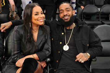Nipsey Hussle and Lauren London attend a basketball game