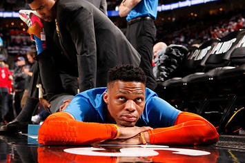 Russell Westbrook stretches before a 2019 playoff game.