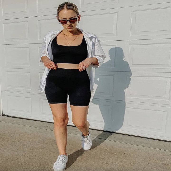 reviewer wearing the black set