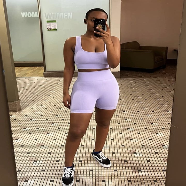 reviewer wearing the purple set