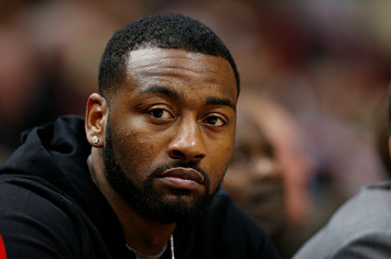 John Wall #2 of the Washington Wizards looks on from the bench
