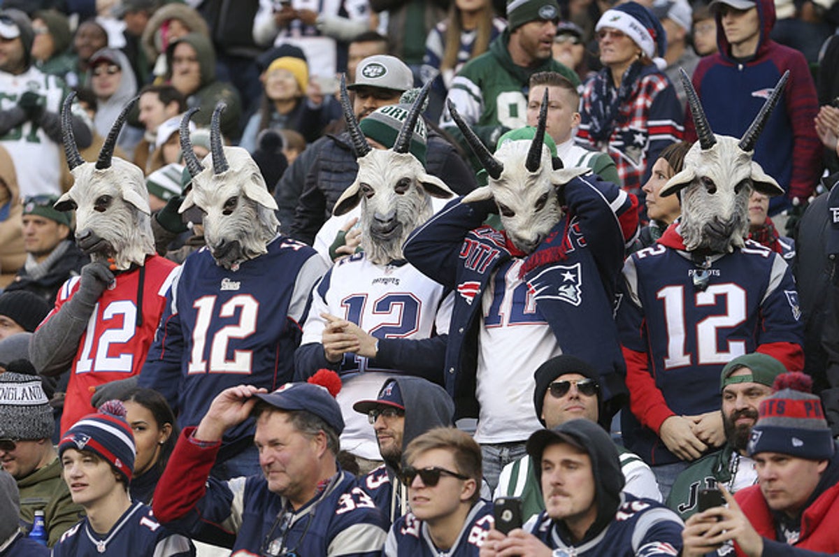 Fans wearing New England Patriots quarterback Tom Brady's number 12 and  wearing goat masks watch the game against the New York Jets at MetLife  Stadium in East Rutherford, New Jersey on November