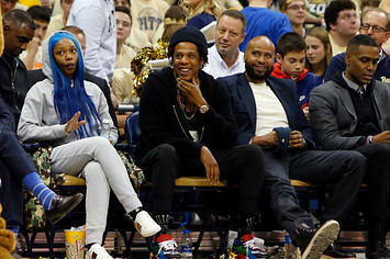 Jay Z laughs during the game between the Pittsburgh Panthers and the Duke Blue Devils