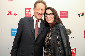 Larry and Pamela Baer pose for a photo on the red carpet.