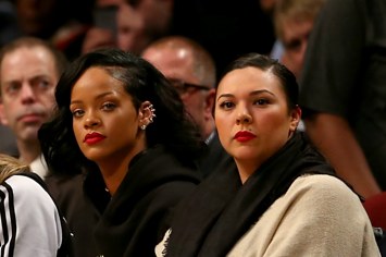 Rihanna and Jennifer Rosales attend NBA game