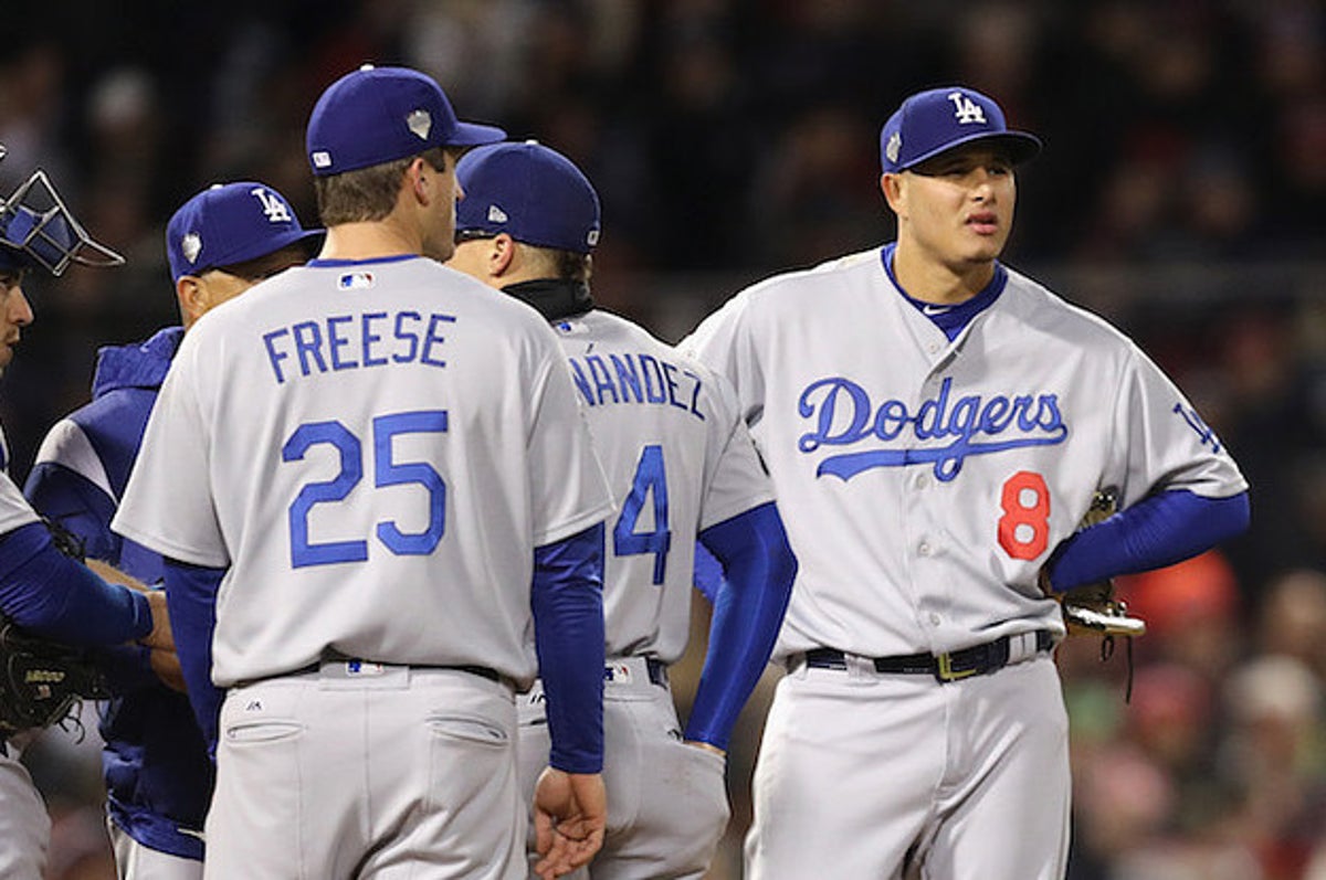 Manny Machado of the San Diego Padres talks with Albert Pujols of