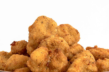 Close up of Chicken Nuggets over a white background
