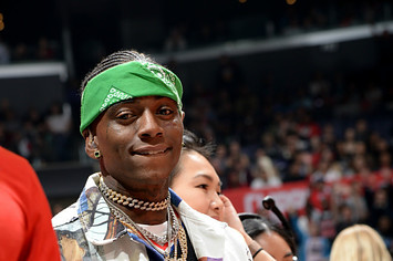 Rapper Soulja Boy looks on during the game