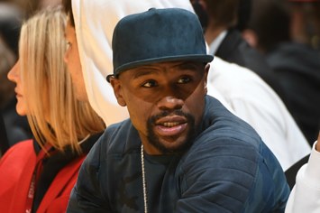 Professional boxer Floyd Mayweather attends a game