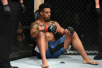 Greg Hardy sits in his corner after being disqualified