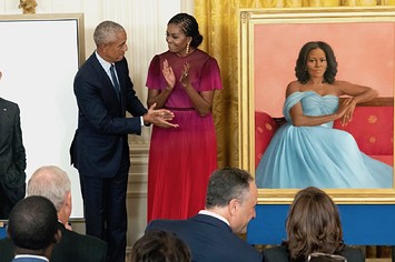 Former U.S. President Barack Obama and First Lady Michelle Obama participate in a ceremony