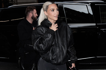 Kim Kardashian is pictured wearing a black leather jacket