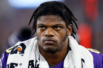 Lamar Jackson looks on during NFL playoff game.