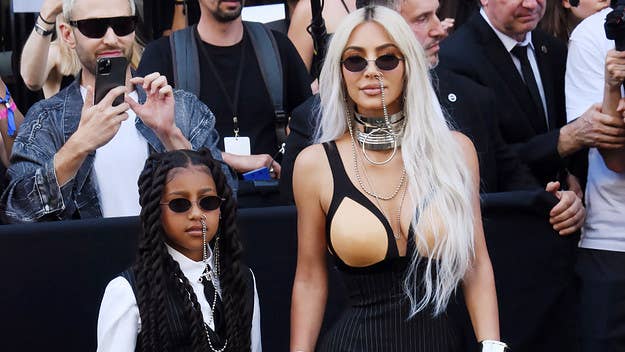 Kim Kardashian took to Instagram to comment on North West flashing a handwritten sign at photographers reading "stop" during Paris Fashion Week.