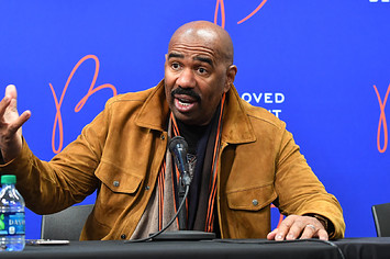 Steve Harvey is pictured speaking with reporters