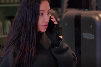 Kim Kardashian is pictured talking on the phone in a dramatic fashion