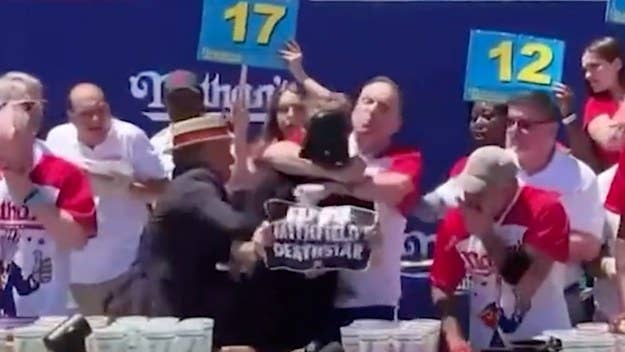 Joey Chestnut has once again showed amateur hot dog eaters how it’s done by polishing off 63 in 10 minutes, all while dealing with a protester.
