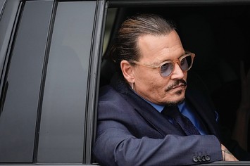 Actor Johnny Depp sits in his vehicle as he departs the Fairfax County Courthouse