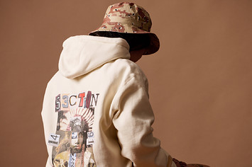 A faceless model wearing a Section 35 hoodie