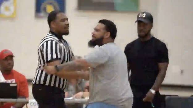 A wild brawl broke out during an AAU basketball game in Kansas City this weekend after a coach and referee exchanged punches following a questionable foul call.