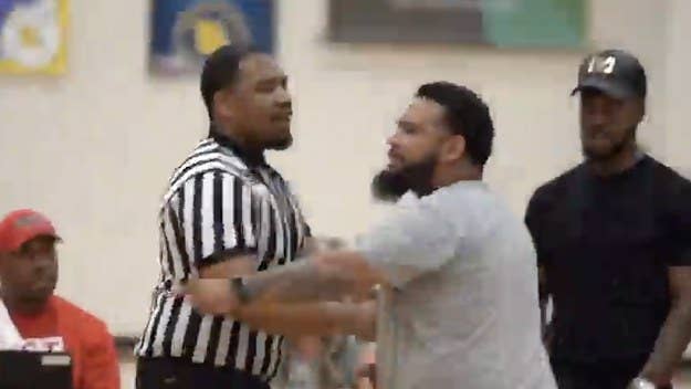 A wild brawl broke out during an AAU basketball game in Kansas City this weekend after a coach and referee exchanged punches following a questionable foul call.