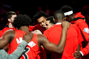 Toronto Raptors players come together for a huddle