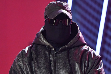 Ye is seen wearing a hat and a mask at a BET event