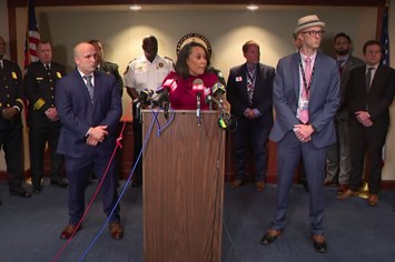 The Fulton County DA stands with law enforcement officers at presser