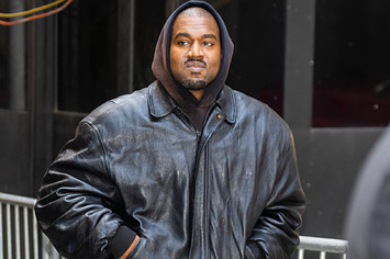 Ye is seen walking while wearing a leather jacket