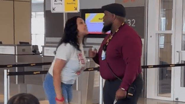 Spirit Airlines has suspended one of its agents after a video showed him tussling with a woman over seating issues at Dallas-Fort Worth Airport. 