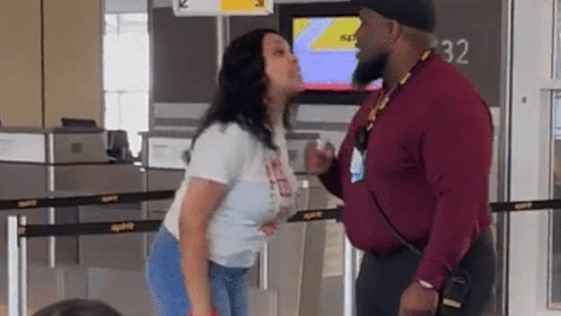 Spirit Airlines has suspended one of its agents after a video showed him tussling with a woman over seating issues at Dallas-Fort Worth Airport.