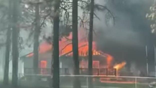 A wildfire that started near the property of a lumber mill in Northern California swept through a nearby neighborhood, destroying about 100 homes and buildings.