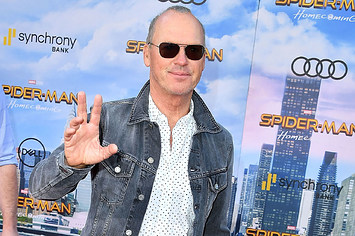 michael keaton holding up his hand like a legend