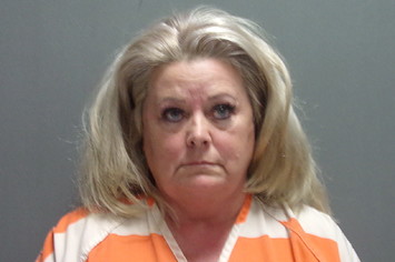 Woman Arrested and Charged With Felony spitting on corpse.
