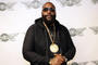 Rick Ross on red carpet at Wingstop event
