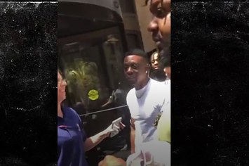 Screenshot from TMZ video showing Boosie Badazz's confrontation with a man outside of a hotel.