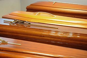 Close-up of the display of caskets for sale in a funeral home