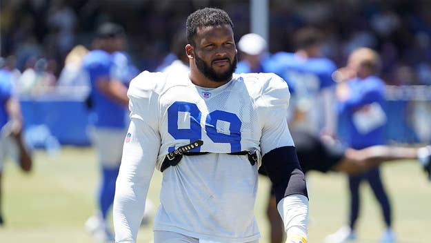 Aaron Donald can be seen swinging two helmets at opposing players in footage of a brawl between Los Angeles Rams and Cincinnati Bengals players.