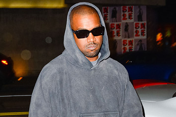 Ye is seen wearing a hoodie and sunglasses