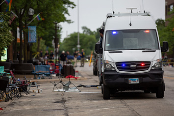 First responders work the scene of a mass shooting at a Fourth of July parade.
