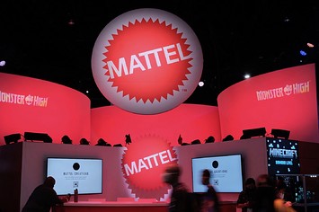 Attendees walk by the Mattel booth during San Diego Comic-Con