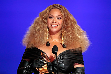 Beyoncé holding a Grammy during the 2021 Grammy Awards ceremony