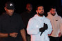 Drake is seen holding a mic