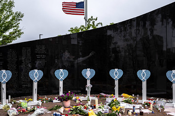 A memorial for Illinois mass shooting victims is pictured