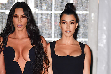 Kim and Kourtney Kardashian posing together