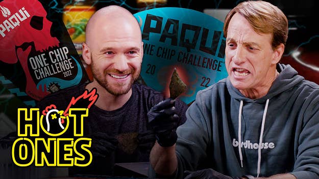 Sean Evans welcomes professional skateboarder Tony Hawk back to the set of Hot Ones, this time to take on Paqui®’s hot ass chip in the #OneChipChallenge.