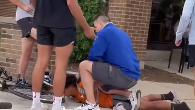Footage shows an unidentified white man who says he’s an off-duty cop pinning down a teen, who is Puerto Rican, and accusing him of stealing his son’s bike.